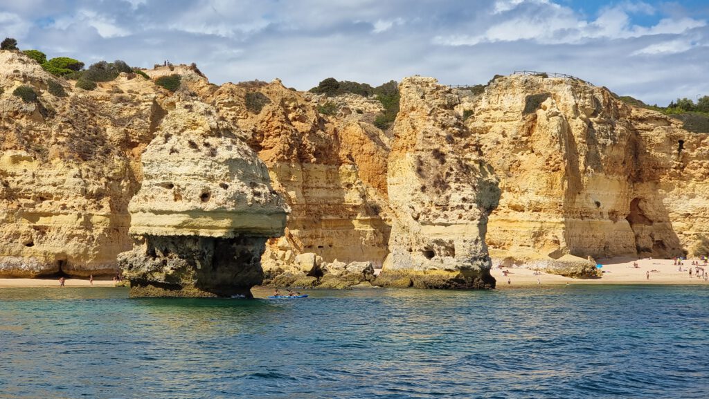 Coast with beige cliff at blue ocean