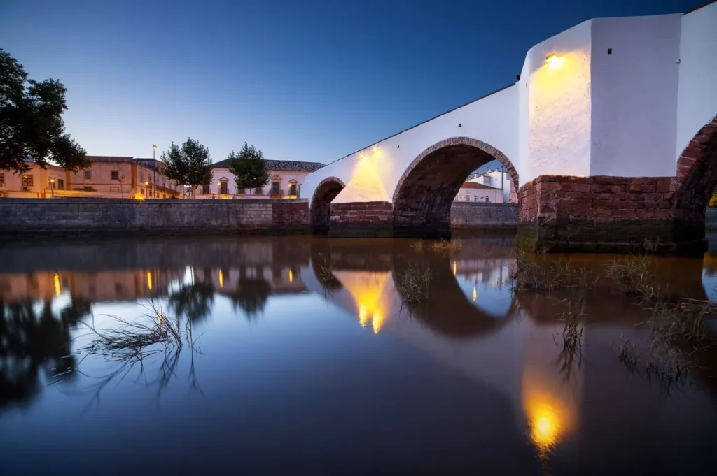 white bridge and a river with reflection